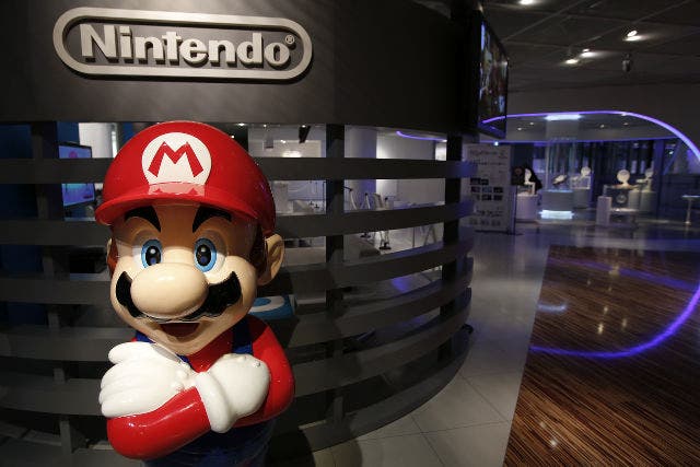 epa04026196 A statue of Nintendo Co.'s video game character Super Mario stands at the company's showroom in Tokyo, Japan, 17 January 2014. Nintendo Co., the world's largest video game maker, announced on 17 January that it would expect to post a net loss of 25 billion yen (176 million euros) for the full year ending March 2014 due to weak sales on console and software in the year-end sales season as the company revised its financial forecast. EPA/KIYOSHI OTA