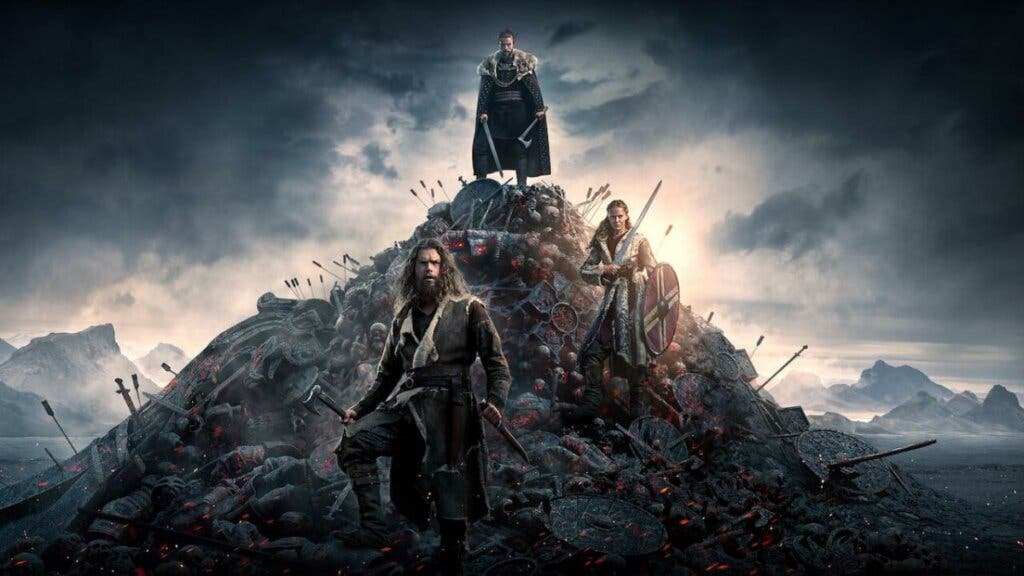 Una montaña con tres personajes de la serie Vikingos: Valhalla